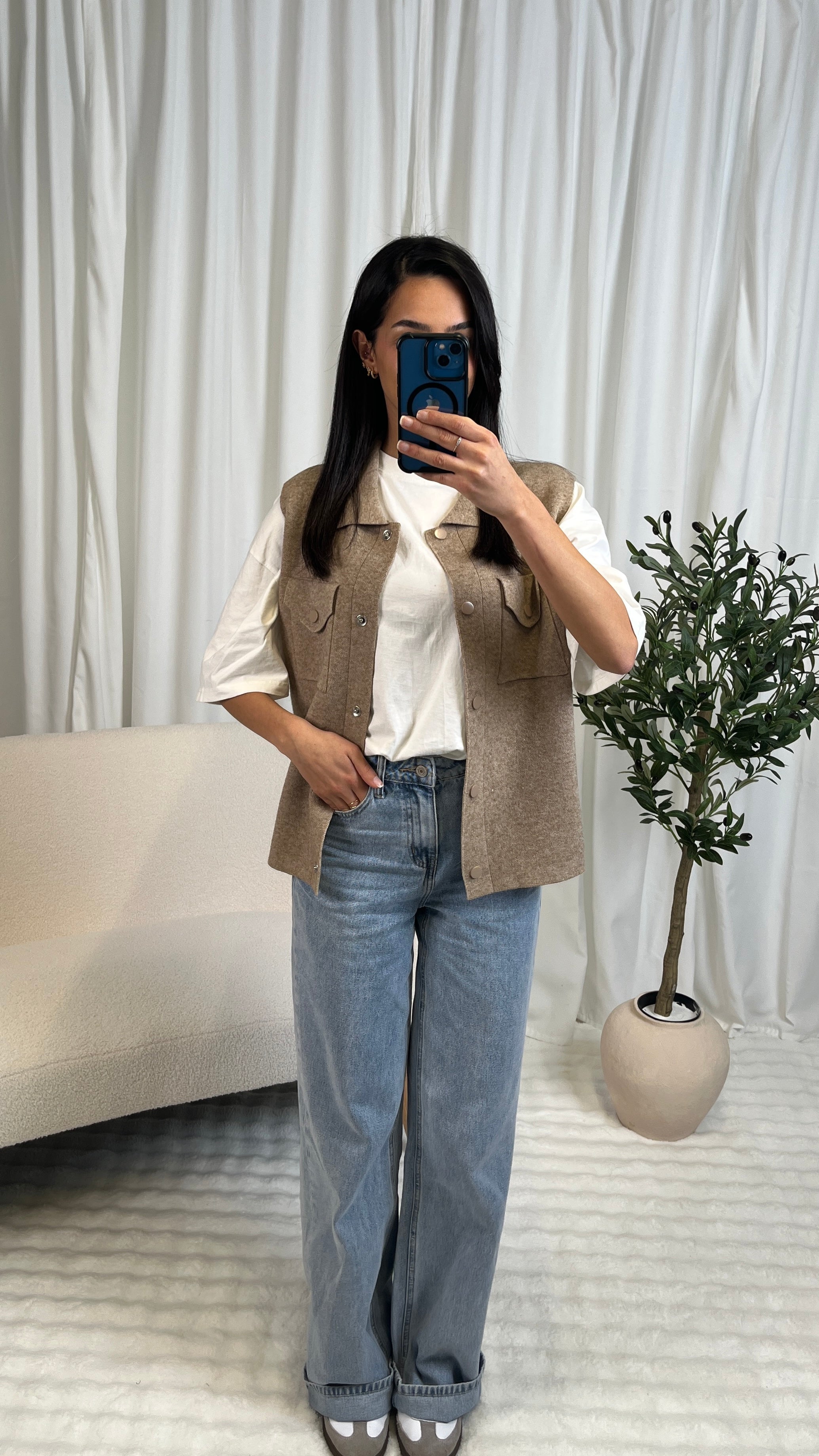 Gilet sans manches à boutons pression